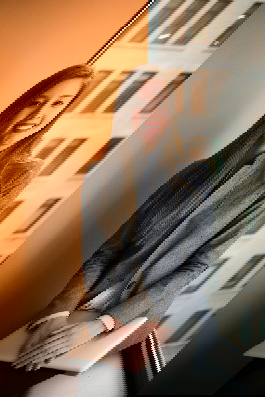 shallow focus photo of woman in gray jacket